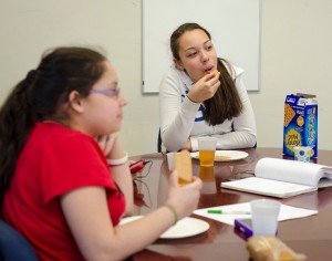 Autumn Sophia Burgos enjoys a snack during the new afterschool program at the Leominster Spanish American Center on Wednesday afternoon. SENTINEL & ENTERPRISE / Ashley Green